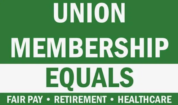 Green sign that reads "Union Membership Equals Fair Pay, Retirement, Healthcare"